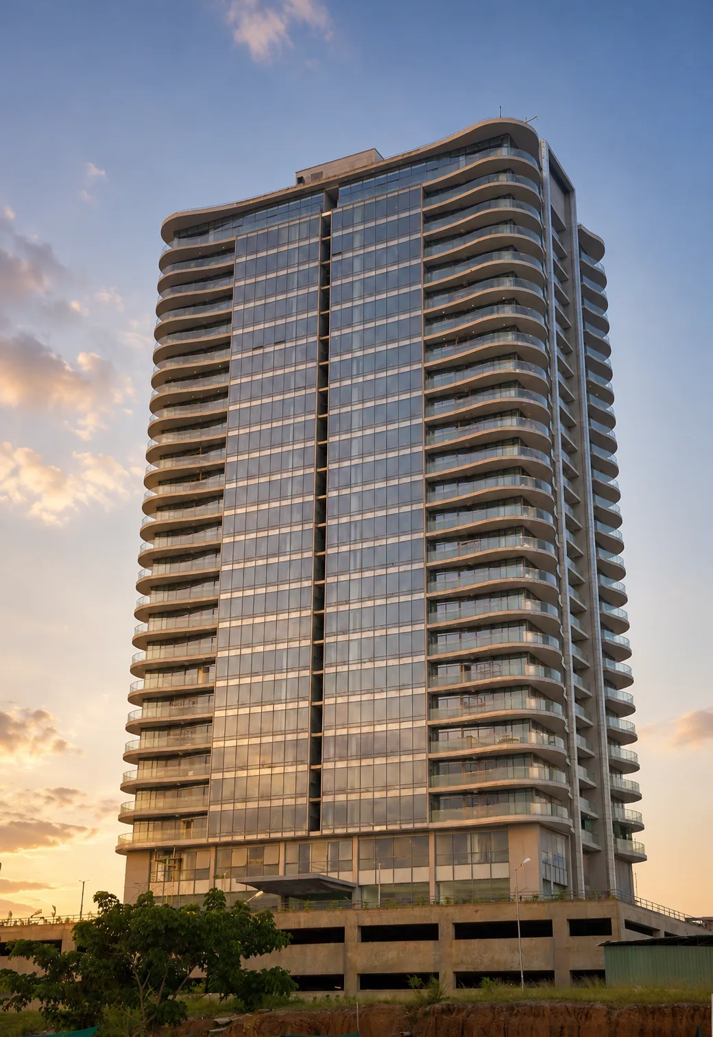 WTC Abuja residential tower exterior at golden hour, Abuja CBD