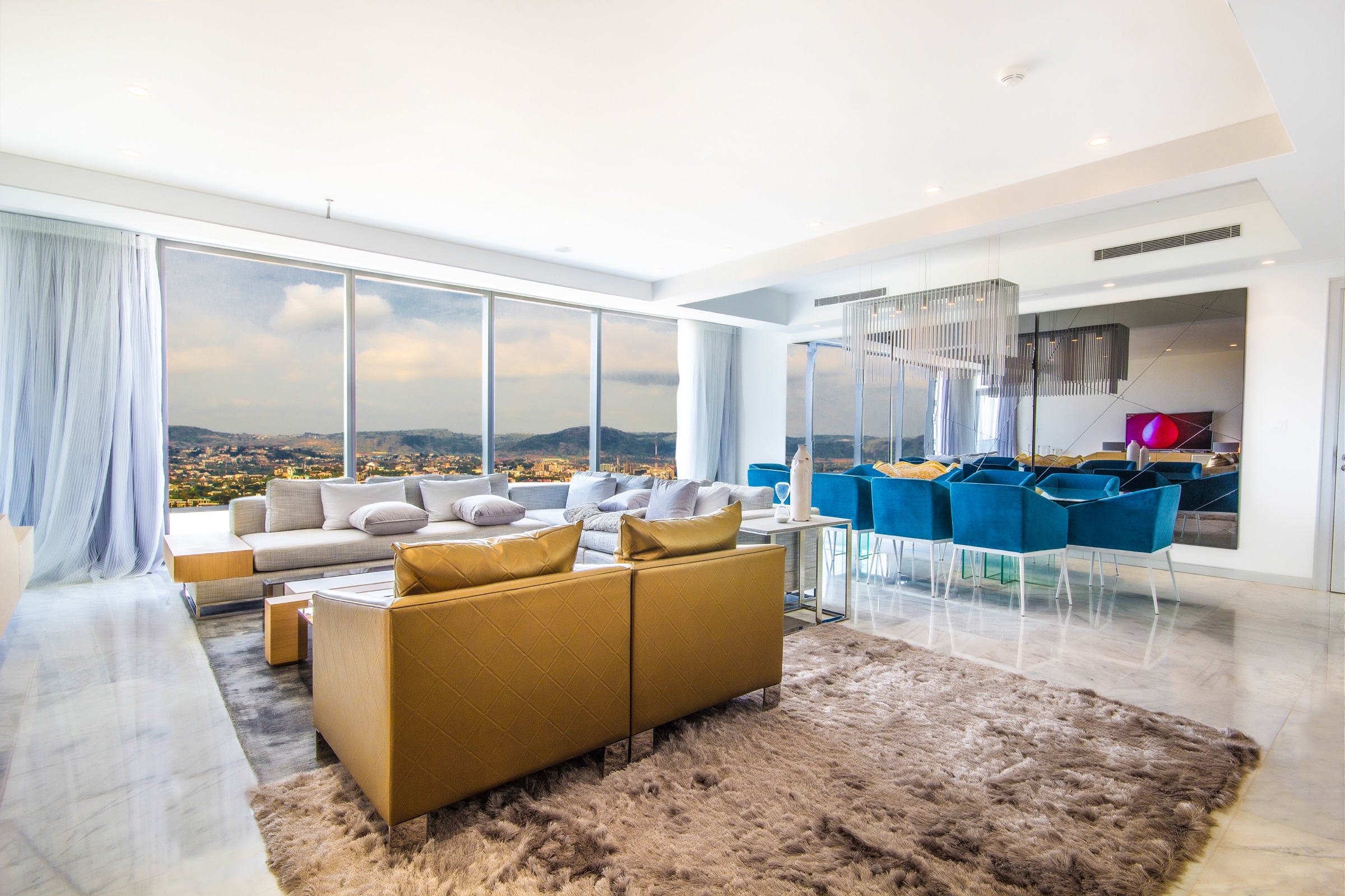 WTC Abuja executive apartment living room, floor-to-ceiling glazing
